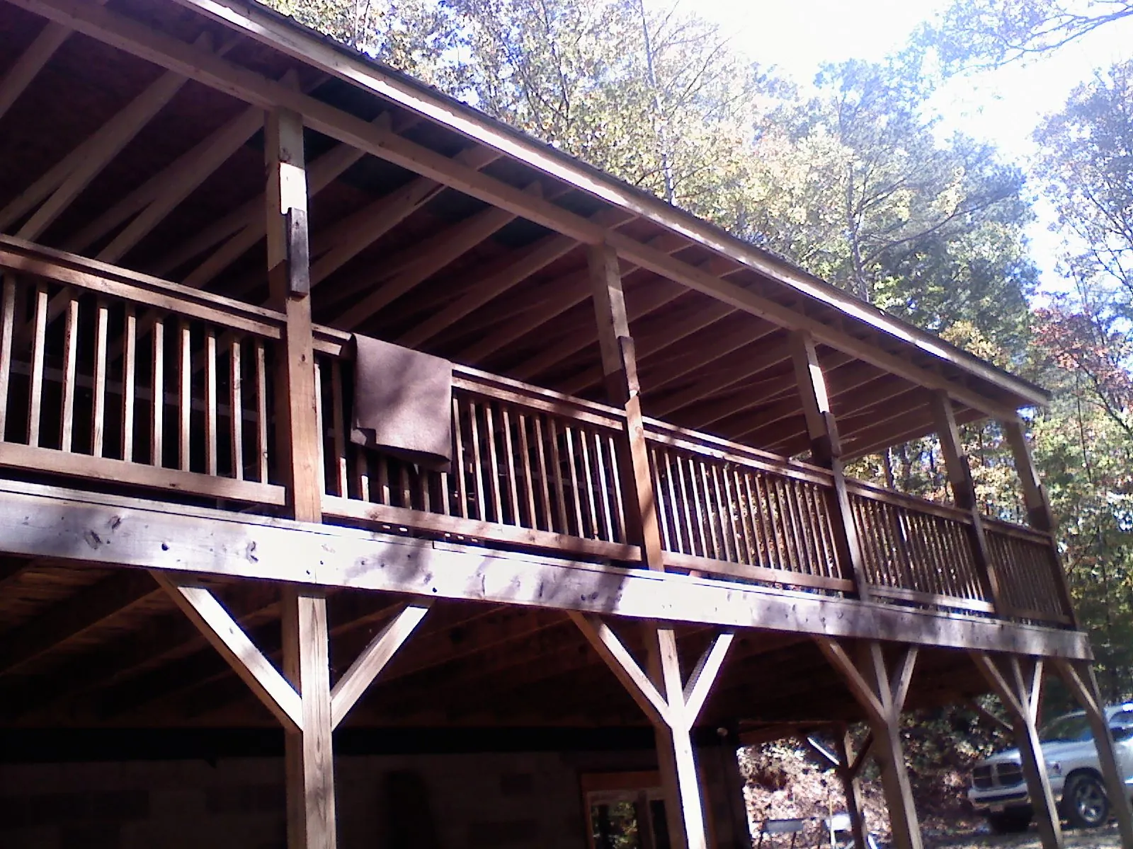 Timber framing under a new elevated porch and deck — Roof Leak Repair in El Dorado Springs by Roofing Brothers